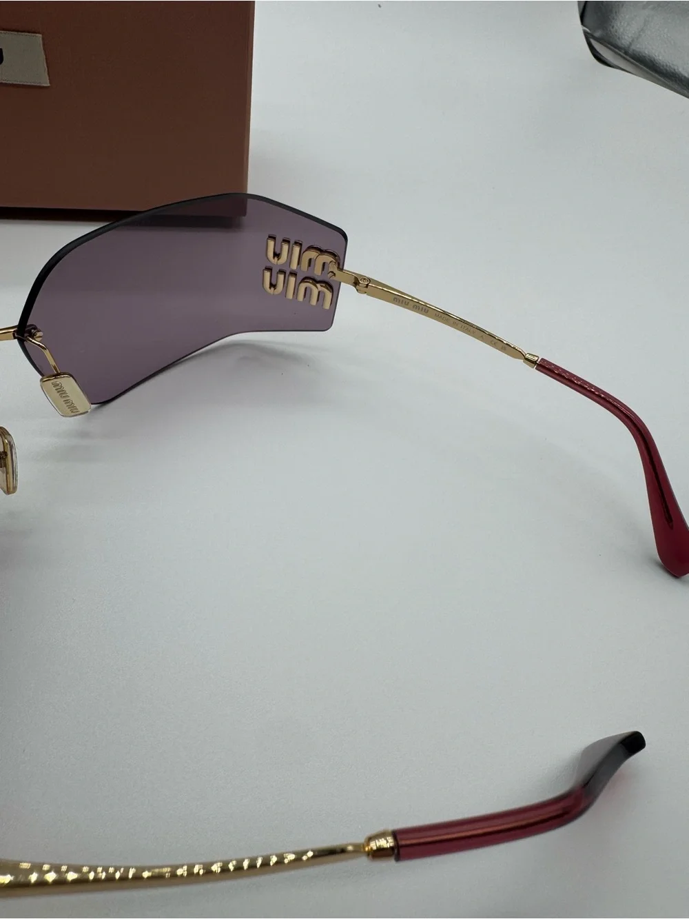 Miu Miu Purple Rimless Sunglasses with Gold Accents